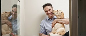 Noel with Labrador in kennel